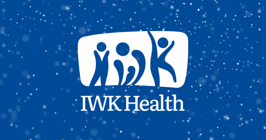 White IWK logo on blue background with snowflakes falling.