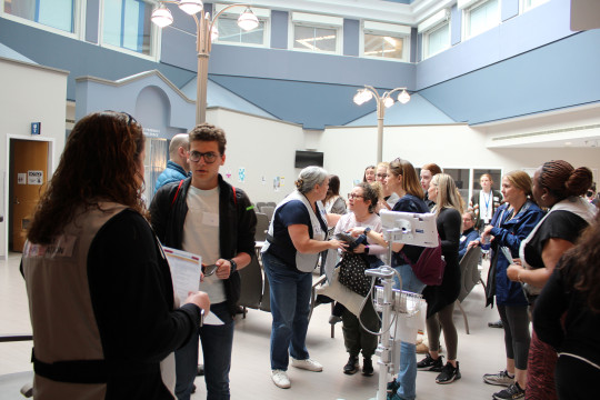 Simulated families interact with caregivers 
