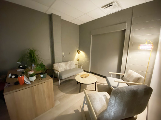A quiet room with comfy chairs and subdued lighting.