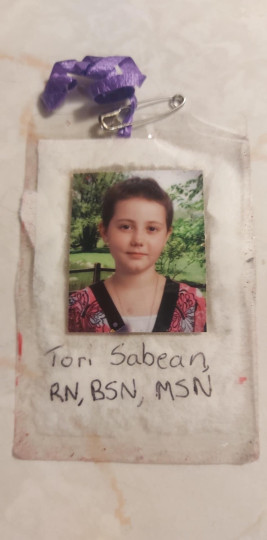 A homemade Nurse ID badge Tori made for herself as a child.