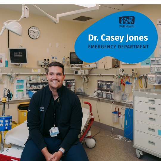Dr. Casey Jones sits on a gurney in an IWK emergency room.