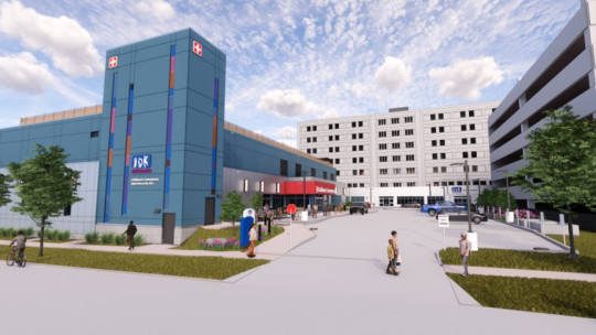 Rendering of the new emergency department features a blue tower with colourful stain glass strips running down the front.