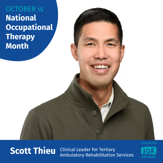 Scott Thieu in a green button v-neck sweater.