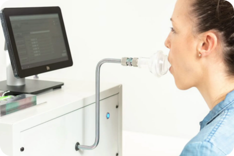 A woman breathes into a breathe sampler