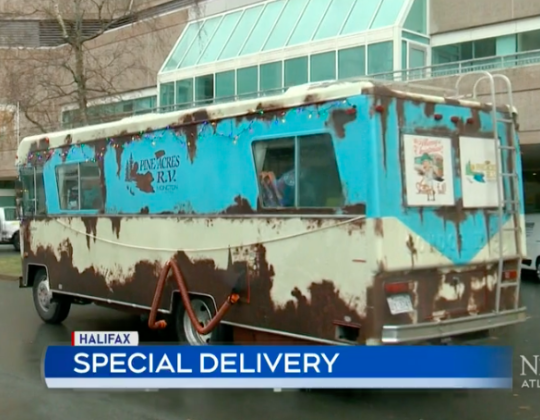 A recreation of the dilapidated RV in National Lampoon's Christmas Vacation pulls up in front of the IWK.