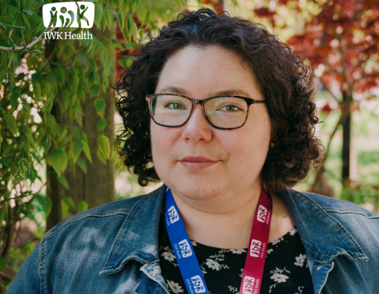 Elora Gehue, Mi’kmaw Indigenous Health Consultant, stand in the Newman Gardens.