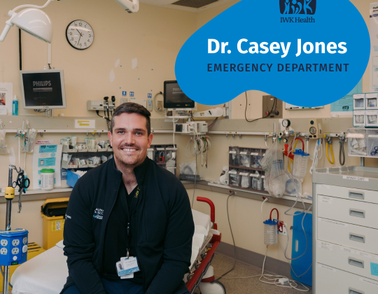 Dr. Casey Jones sits on a gurney in an IWK emergency room.