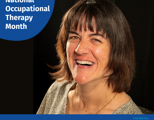 Jaime Blenus smiles at the camera. October is National Occupational Therapy Month.