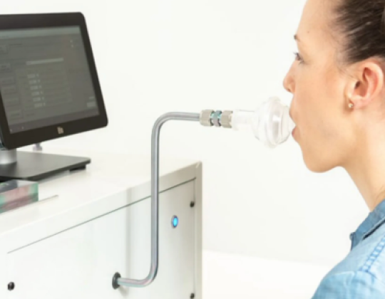 A woman breathes into a breathe sampler